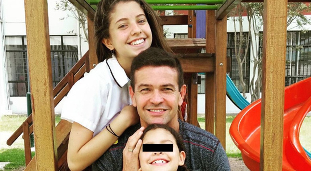 Orlando Fundichely al lado de sus dos hijas.   